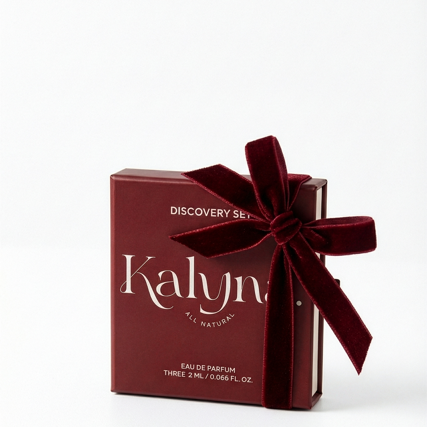Red Kalyna perfume discovery set with a bow on a white background