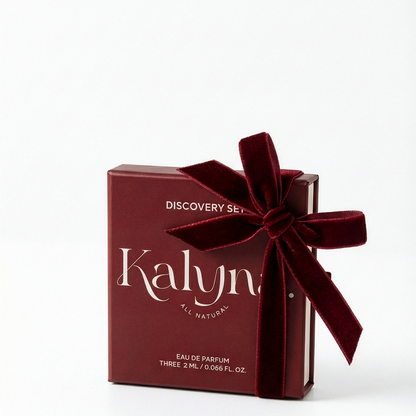 Red Kalyna perfume discovery set with a bow on a white background