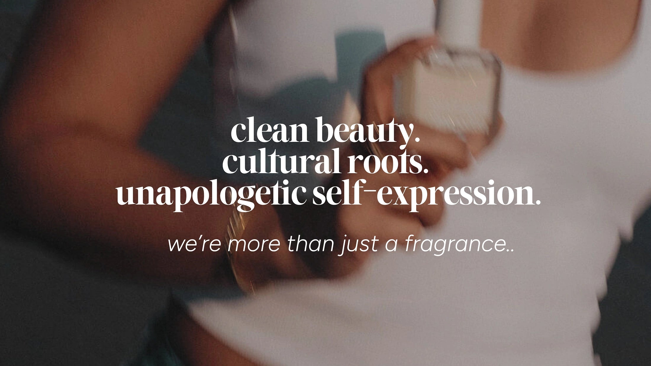 clean beauty. image of woman holding Kalyna fragrances. perfume bottle